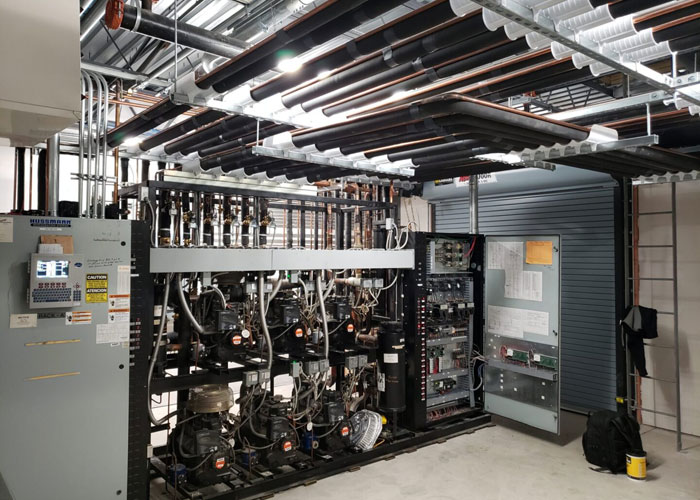 A room with many wires and some electrical equipment.