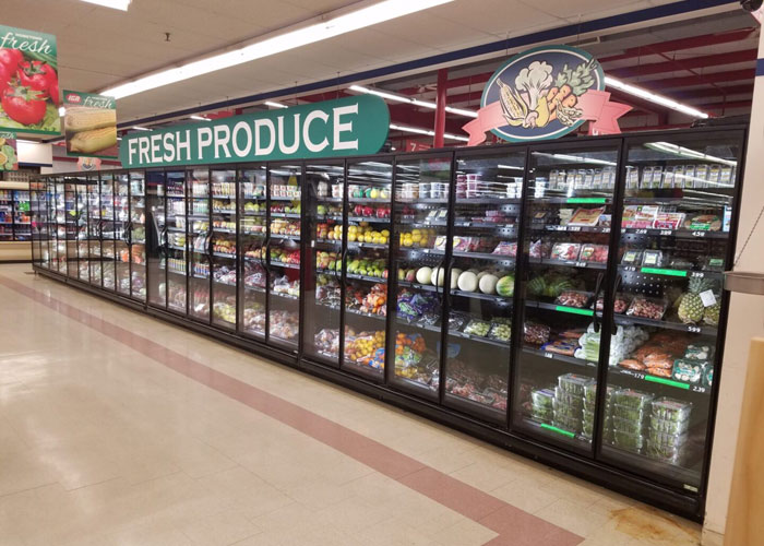 A produce section of a grocery store with fresh produce.